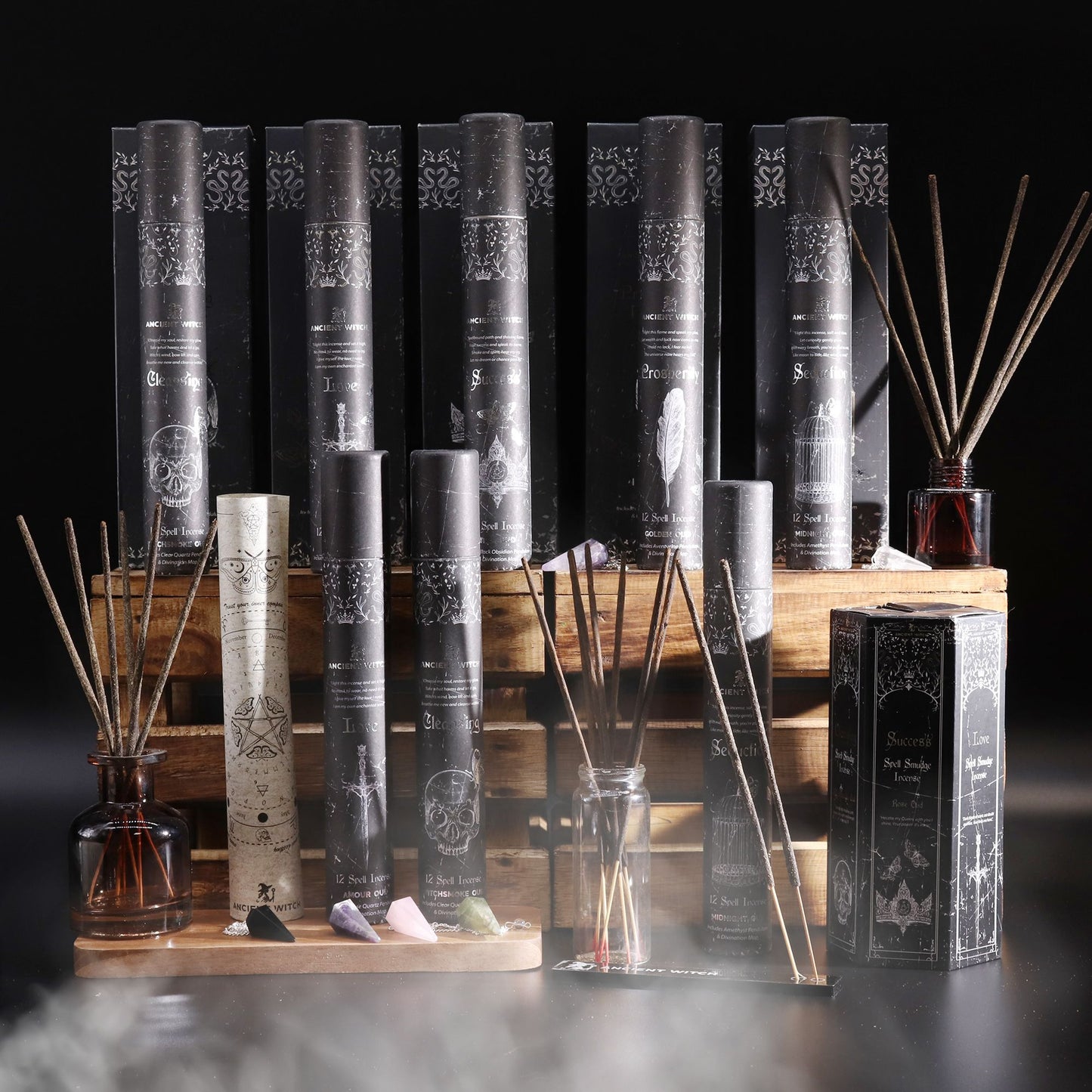 Ancient Witch Spell Incense: Seduction, Amethyst Pendulum - black tubes on wooden display with crystals.