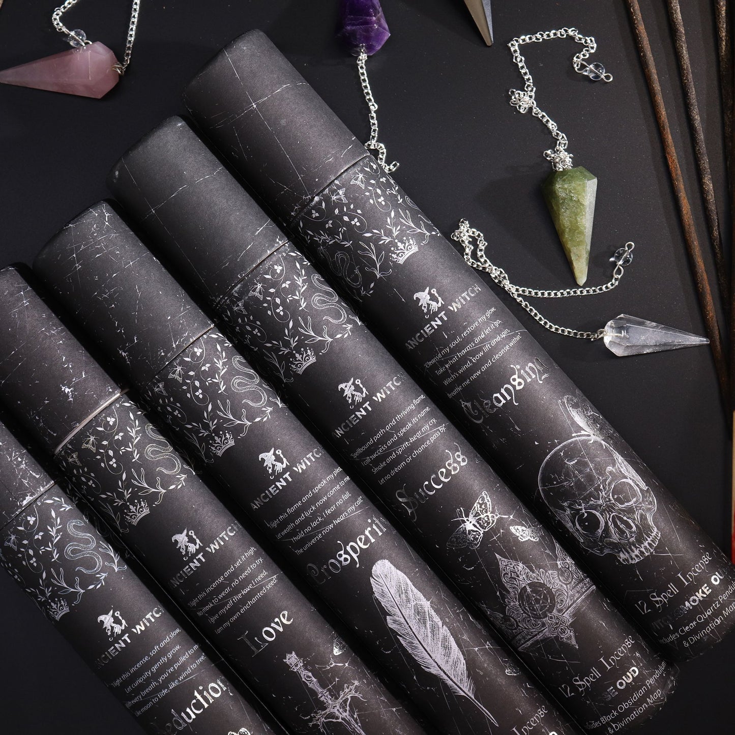 Ancient Witch Seduction Spell Incense tubes with an amethyst pendulum necklace and crystal accents.